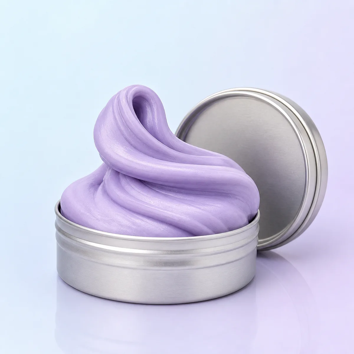 Calm Putty: lavender silicone putty folded above an open silver tin