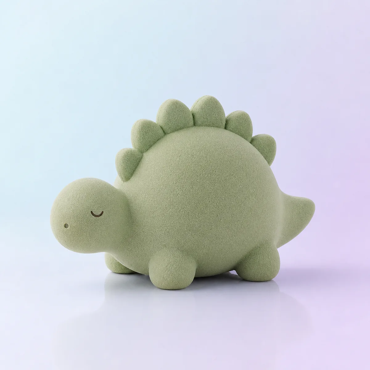 Rumble Dino Slow-Rise Squishy: sage foam dinosaur on a soft pastel background