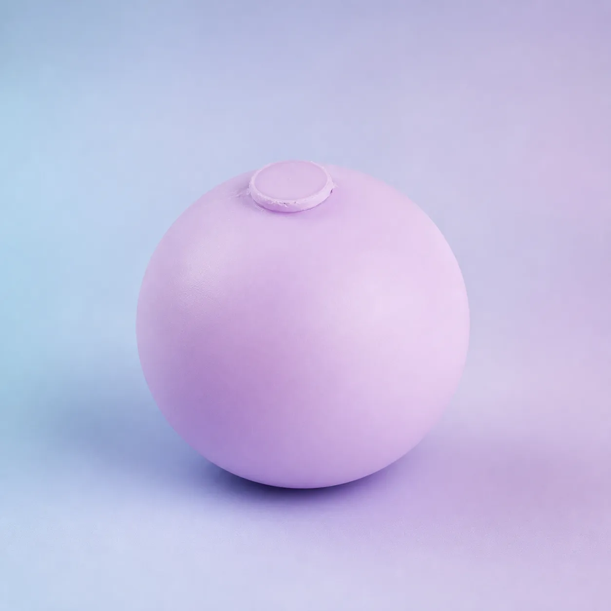 Mold & Hold Dough Stress Ball, Assorted shown on a soft pastel studio background