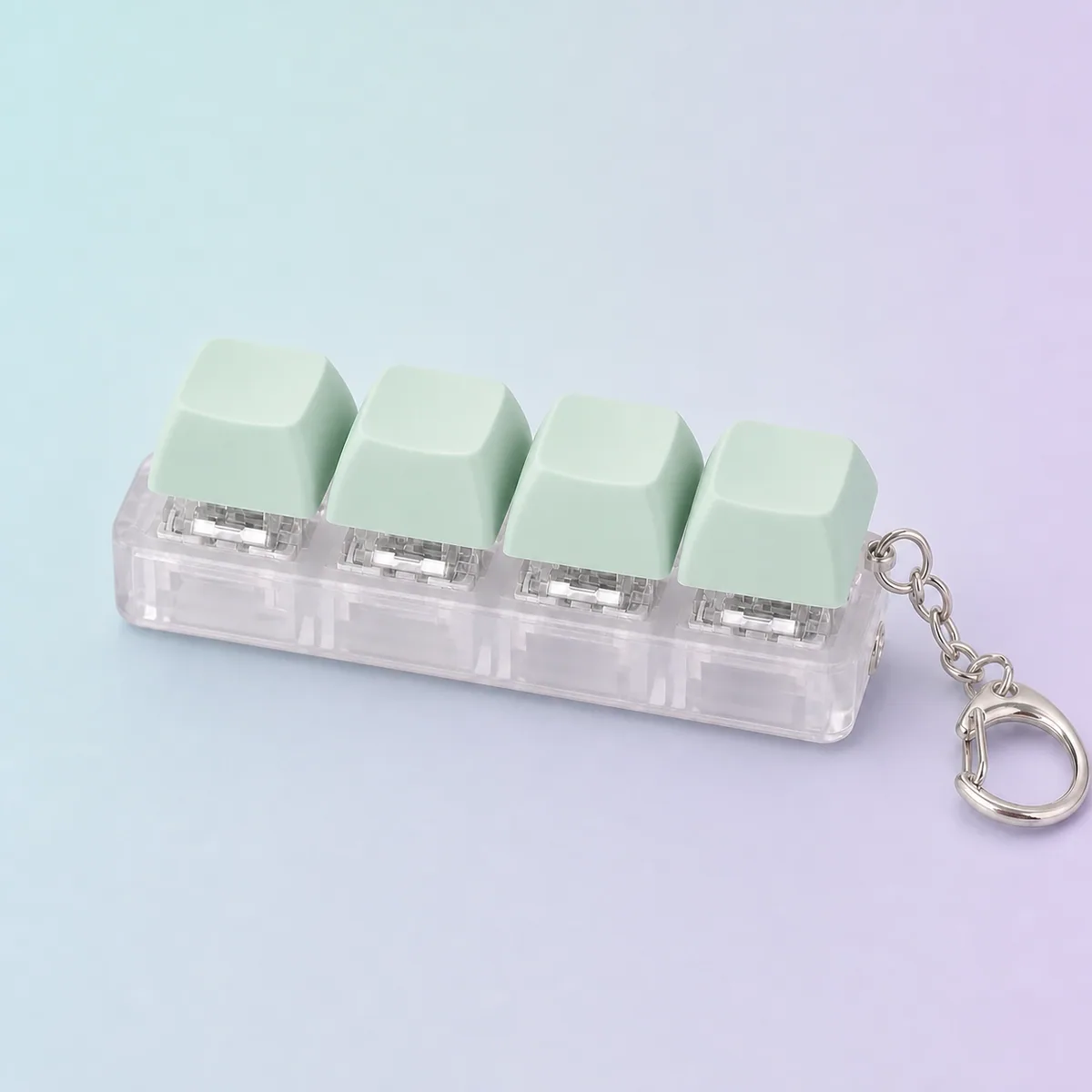 Clicky Keys Keyboard Fidget, Mint shown on a soft pastel studio background