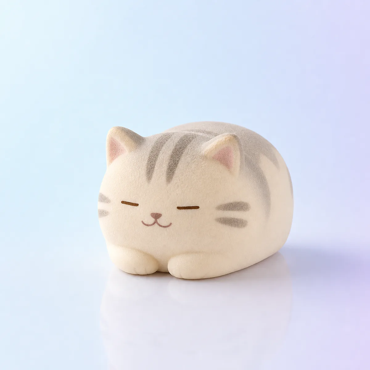 Loaf Cat Slow-Rise Squishy: cream and grey sleepy cat foam toy