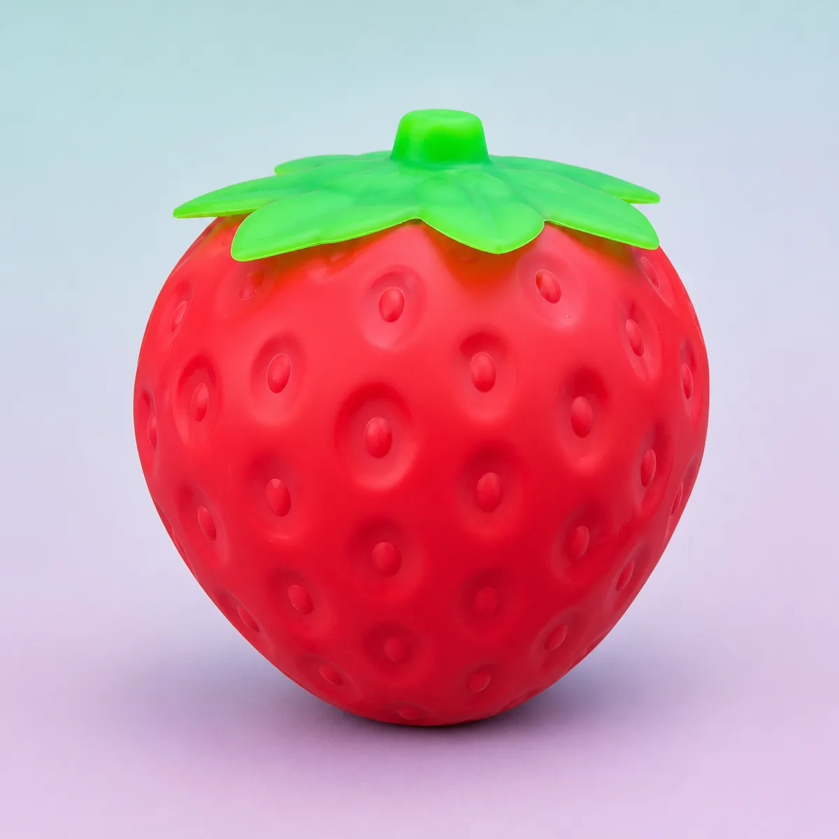 Berry Slow-Rise Squishy, Classic Red shown on a soft pastel studio background