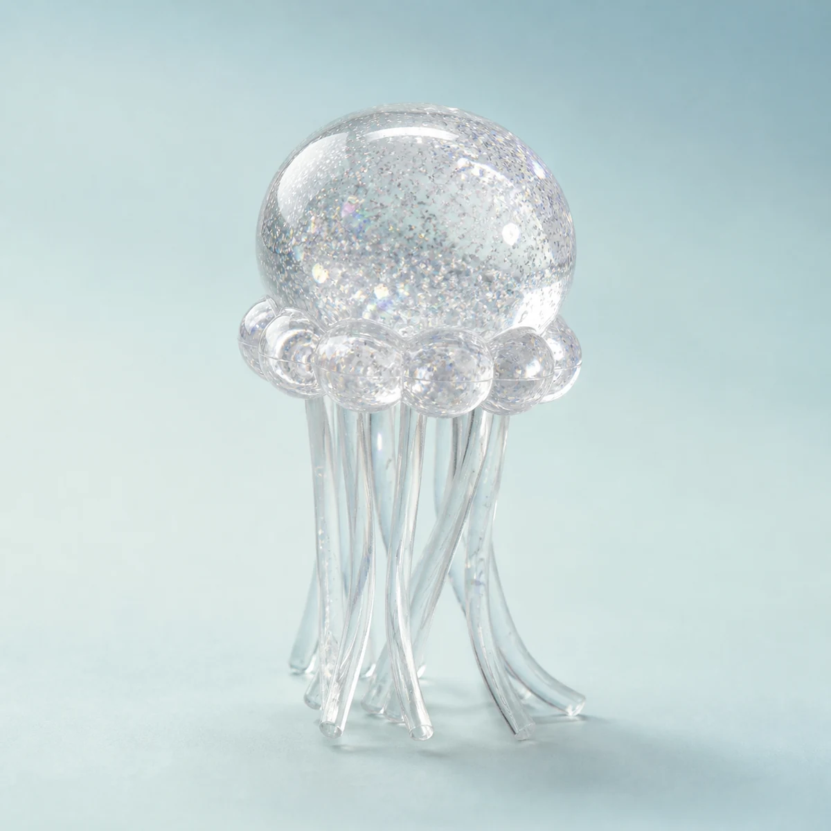 Crystal Clear Lumi jellyfish squishy with fine silver sparkle and transparent tentacles
