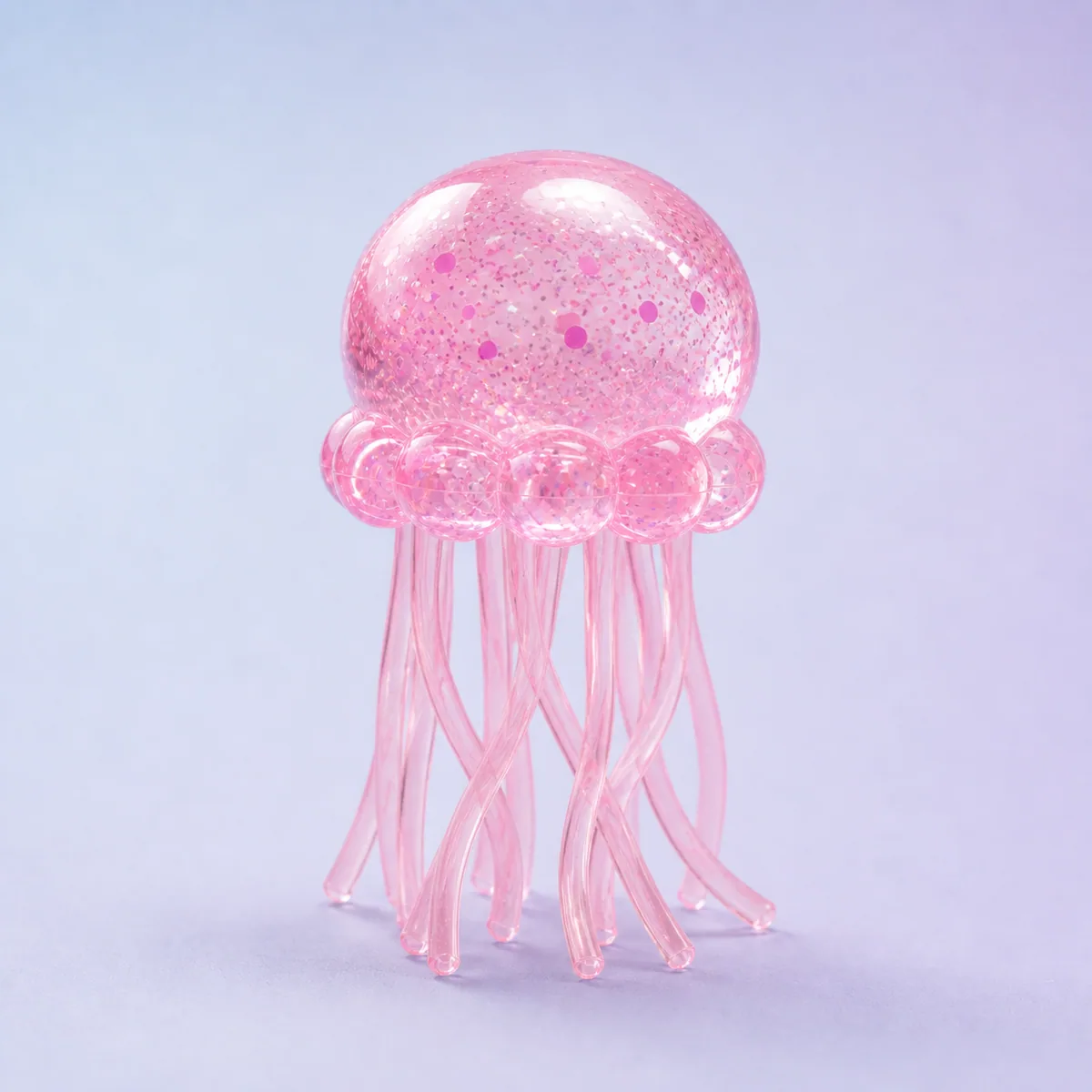 Lumi Jellyfish Crystal Squishy, Bubblegum Pink shown on a soft pastel studio background